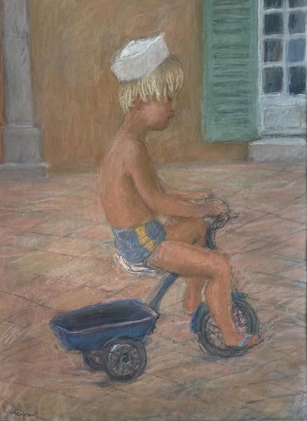 Sur la terrasse, enfant au tricycle